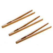 Load image into Gallery viewer, Wooden tongs in use