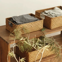 Load image into Gallery viewer, Woven seagrass baskets on a wooden shelf
